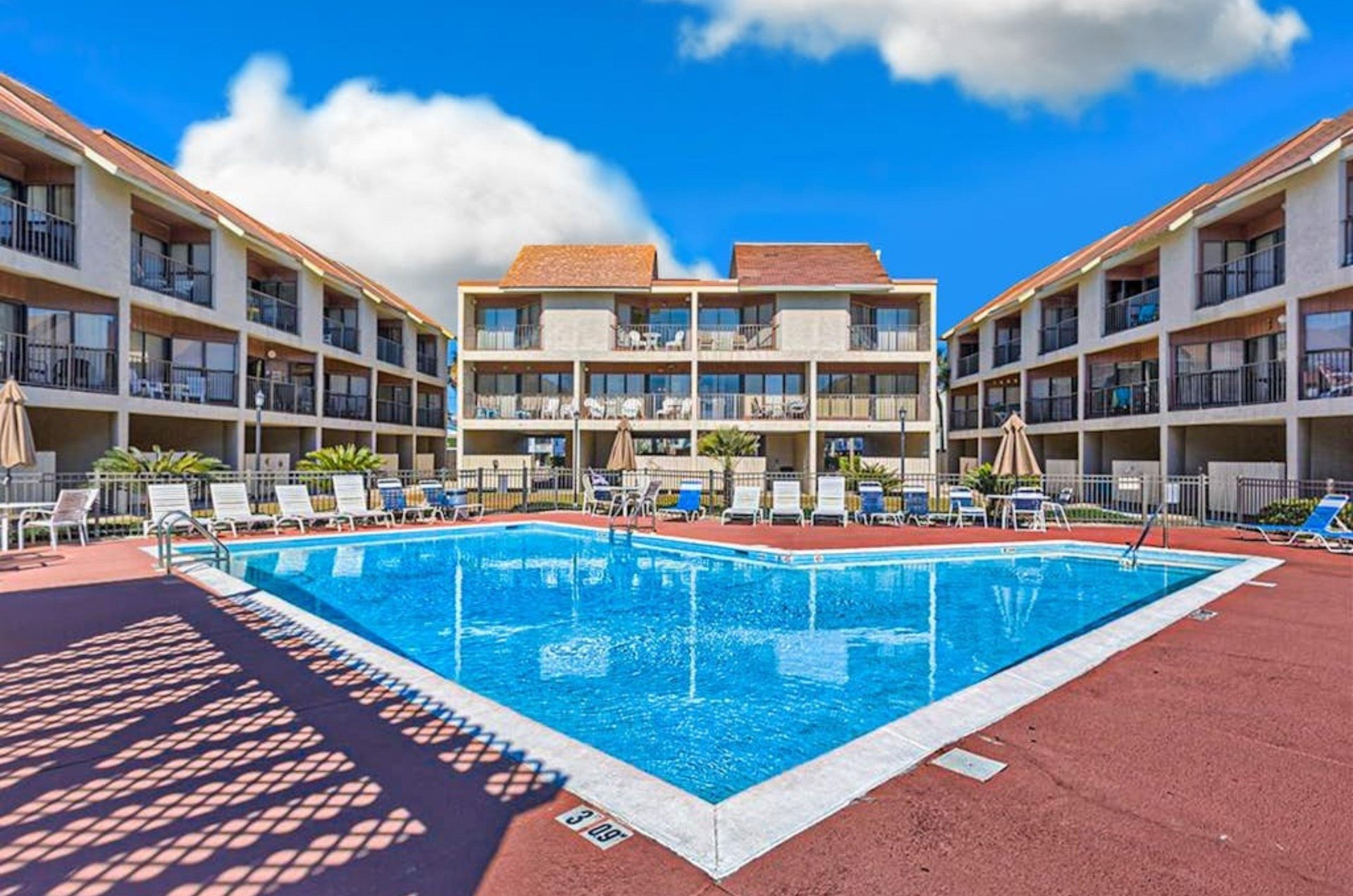 The outdoor swimming pool in front of Gulfside Townhomes in Gulf Shores Alabama