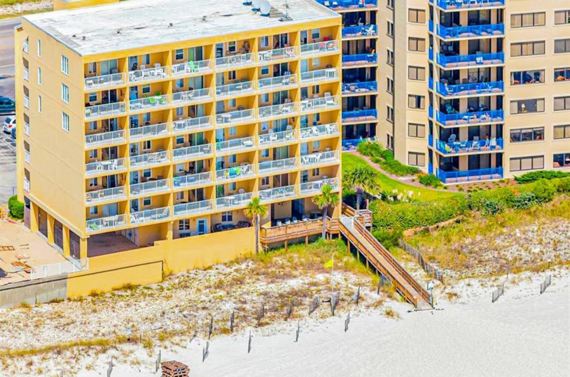 Birds eye view of Emerald Skye next to the beach in Orange Beach Alabama