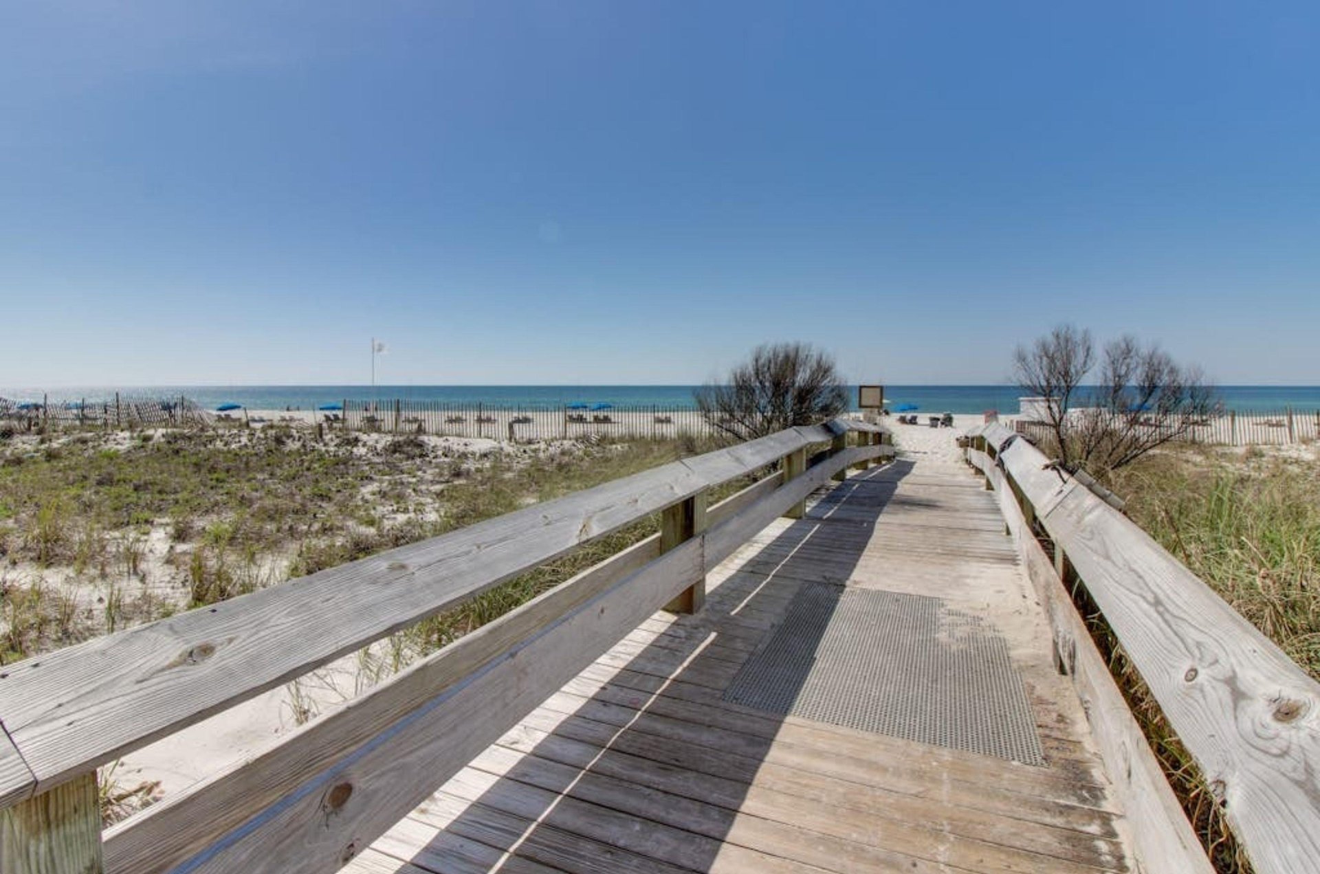 A wooden boardwalk leading to the beach in Orange Beach Alabama