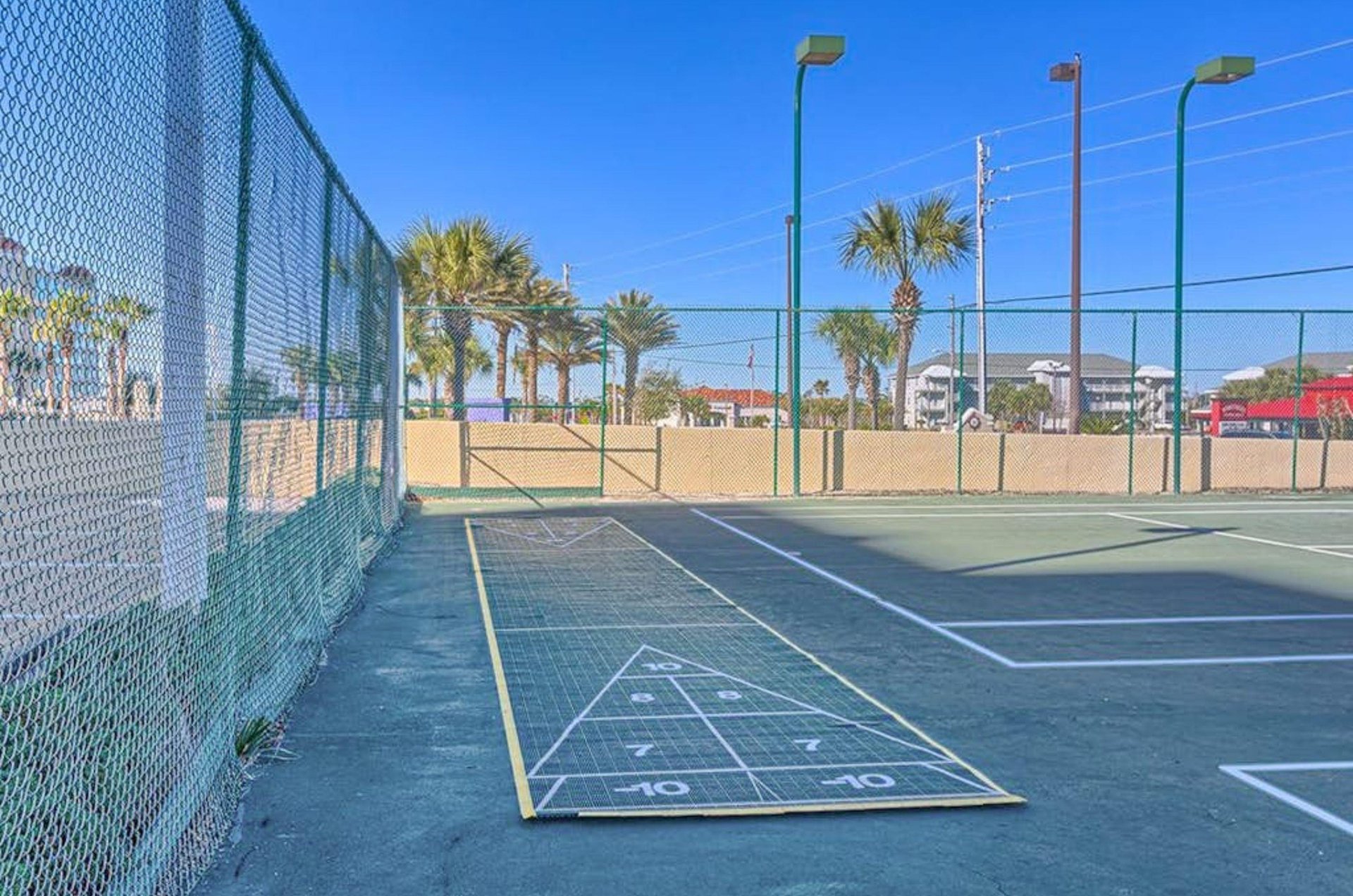 The outdoor shuffleboard courts at Phoenix I in Orange Beach Alabama