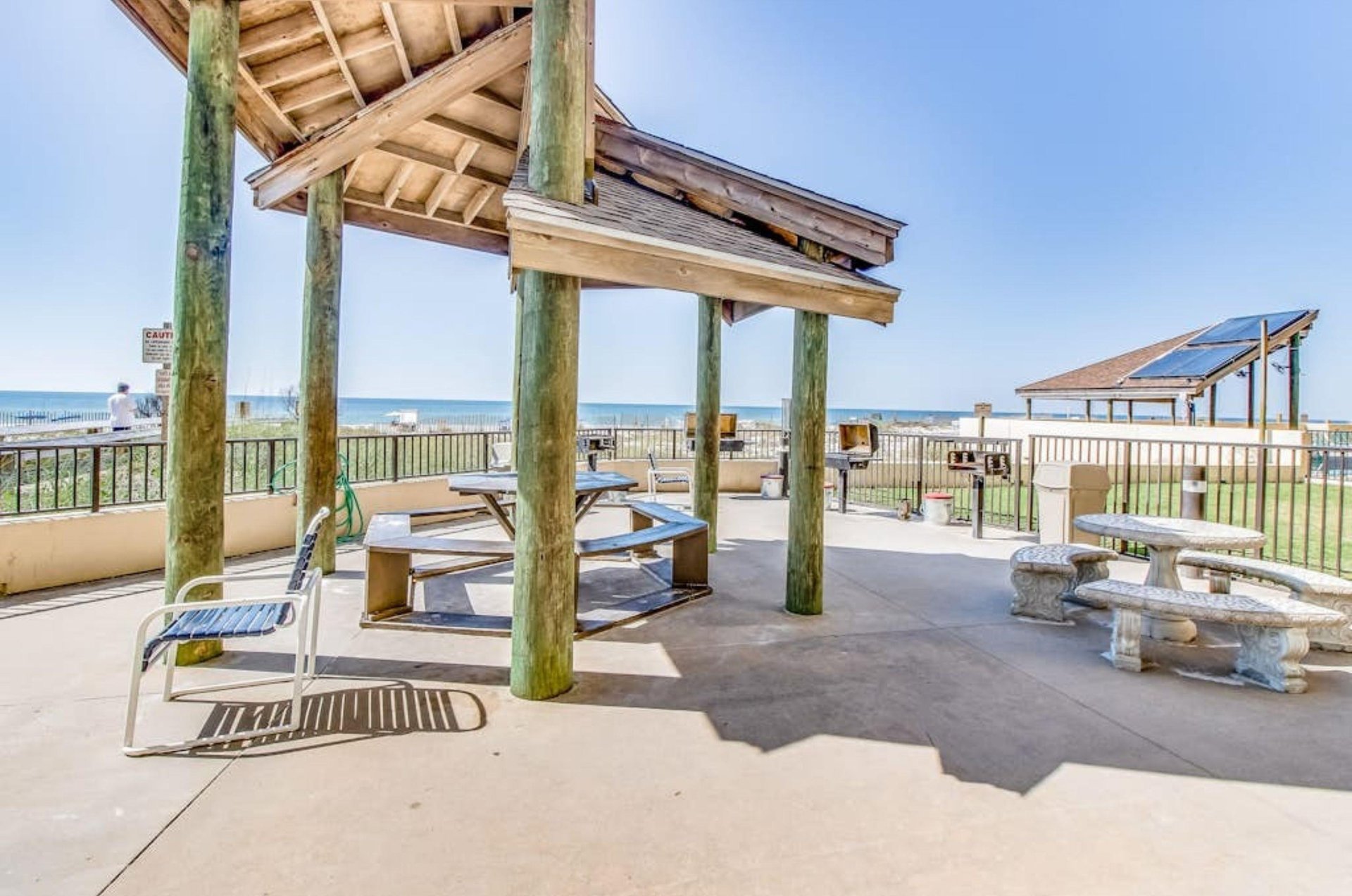 The oudoor barbecue grills next to the picnic tables under a gazebo at Phoenix III