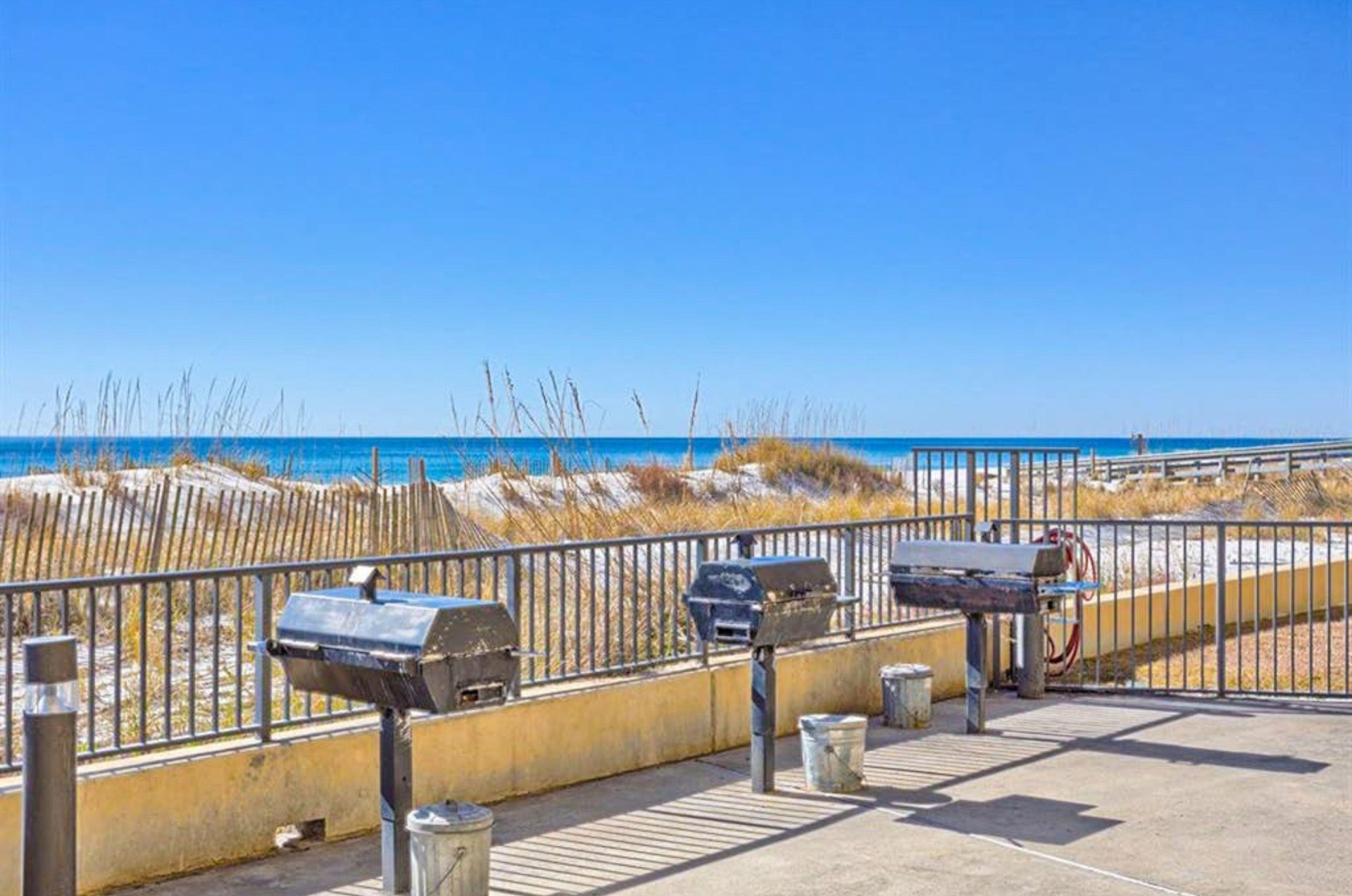 Charcoal grills by the beach at Phoenix V in Orange Beach Alabama