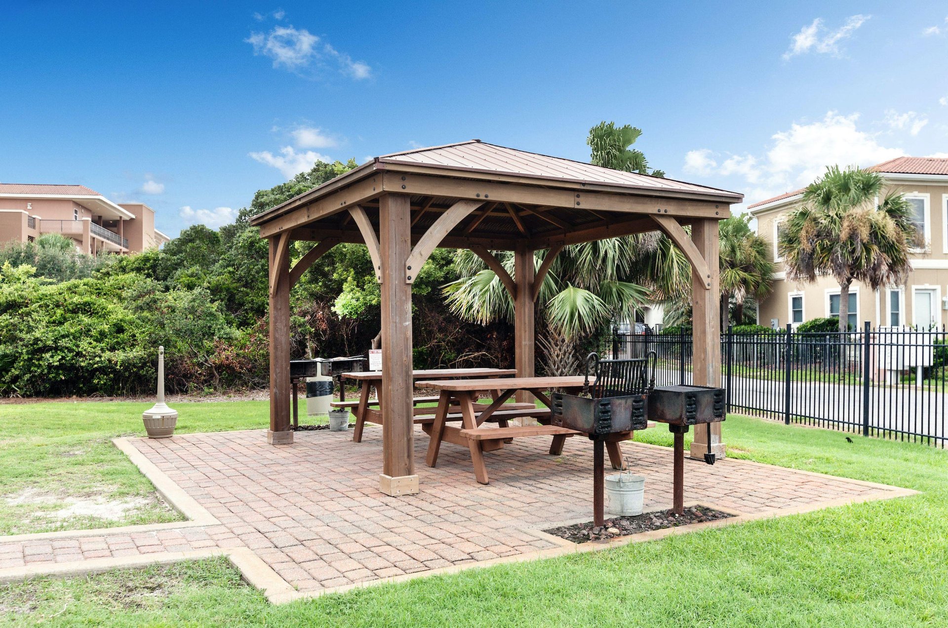 Ciboneys grill area with picnic tables under a gazebo.