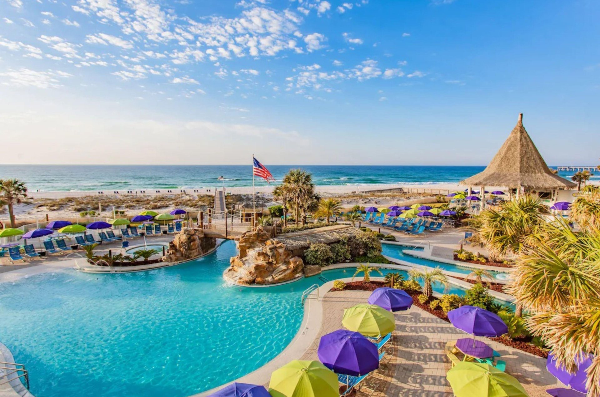 Relax on the spacious pool deck and take in the beach views