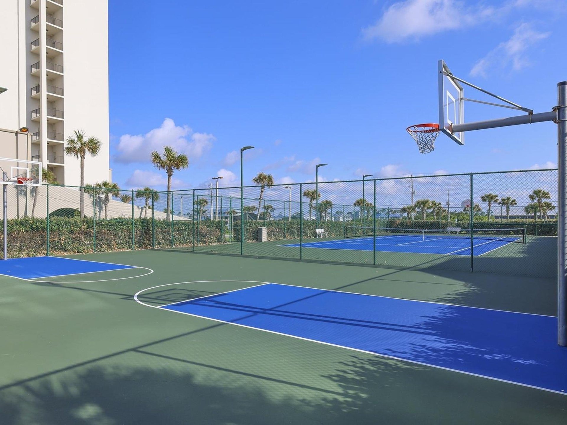 The outdoor tennis courts next to The Oasis at Orange Beach