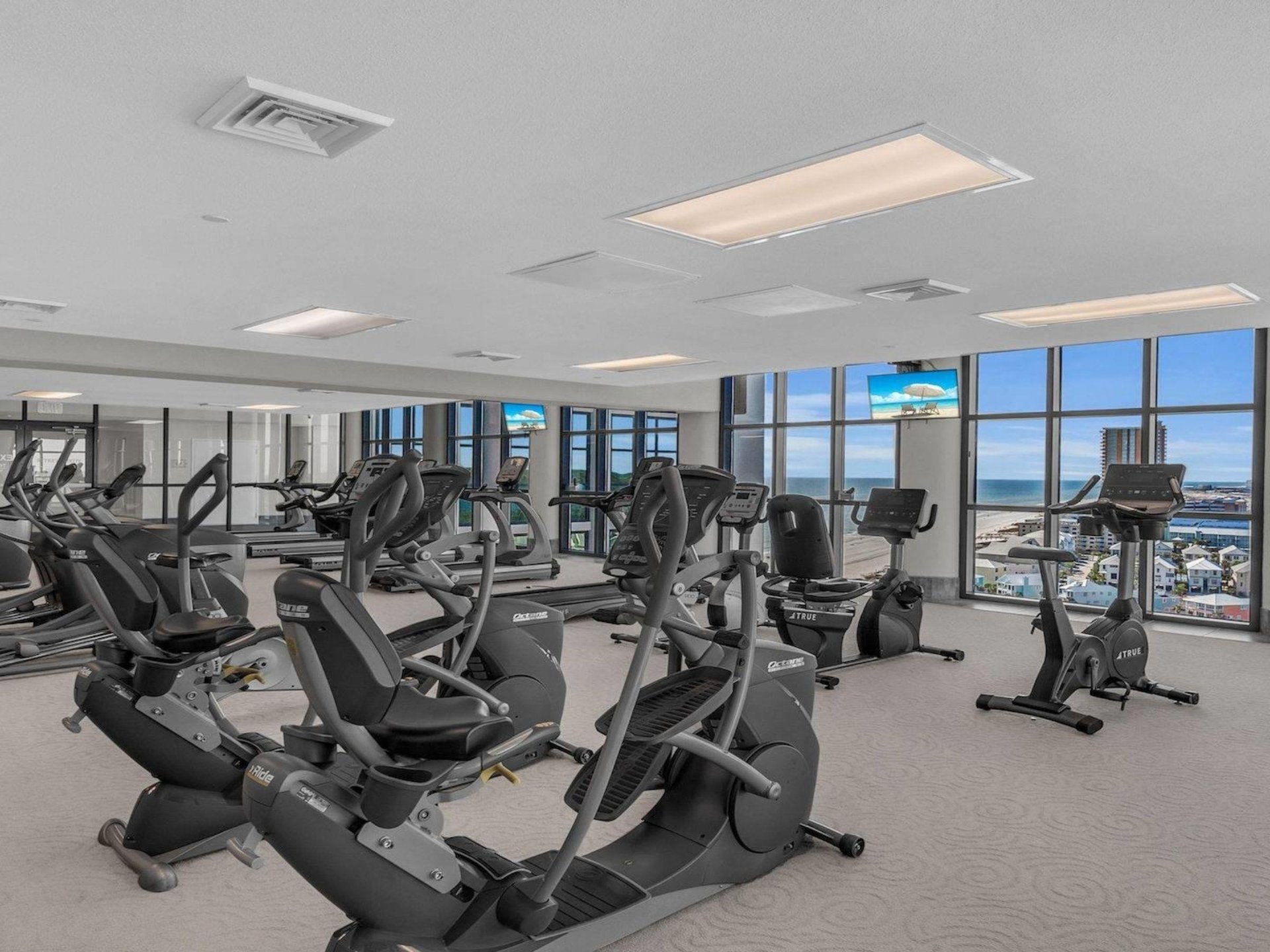 Equipment in the gym at The Oasis at Orange Beach