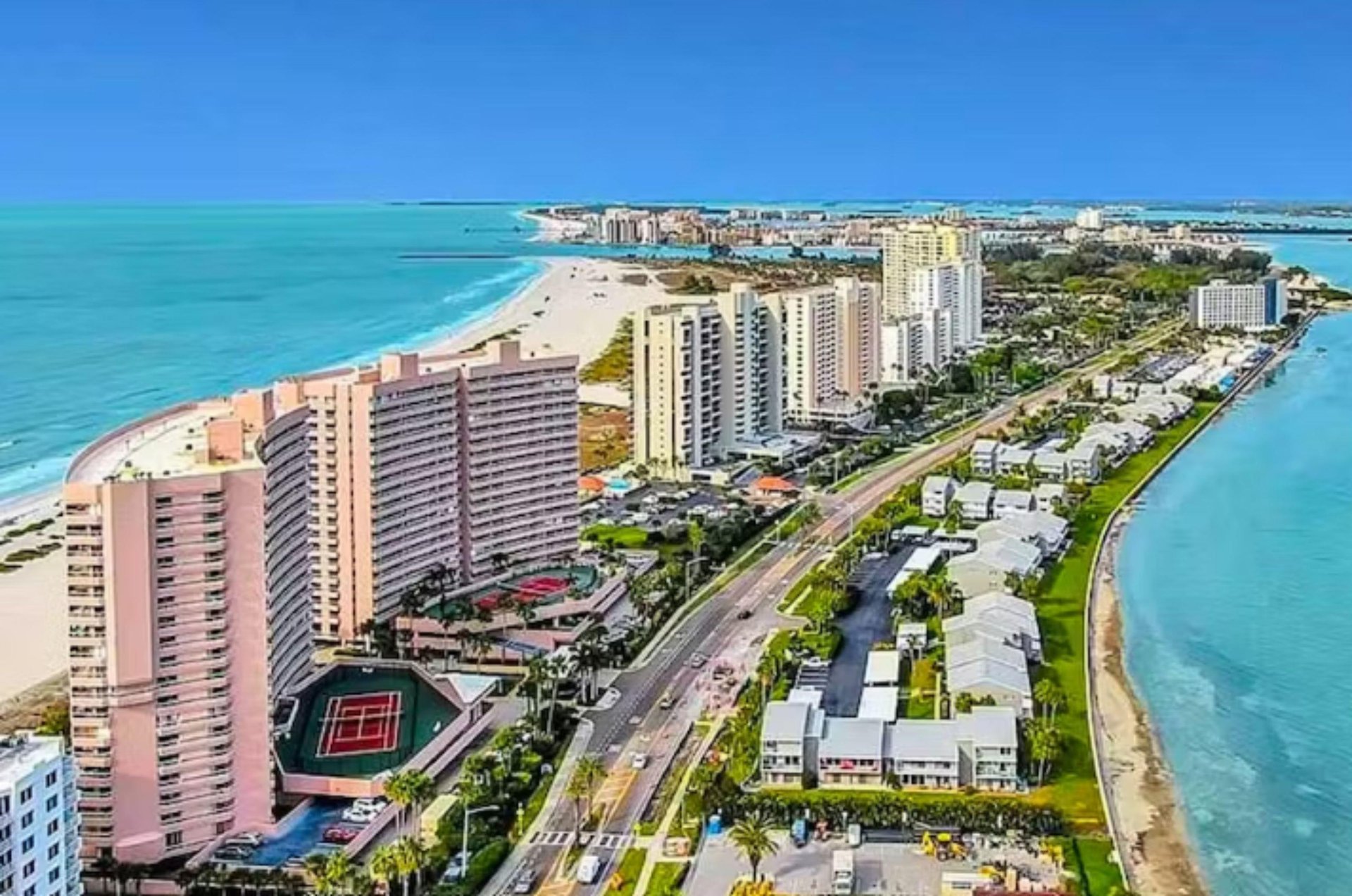 Crescent Beach Clubs high rises in the foreground seated alongside a beautiful Clearwater beach.