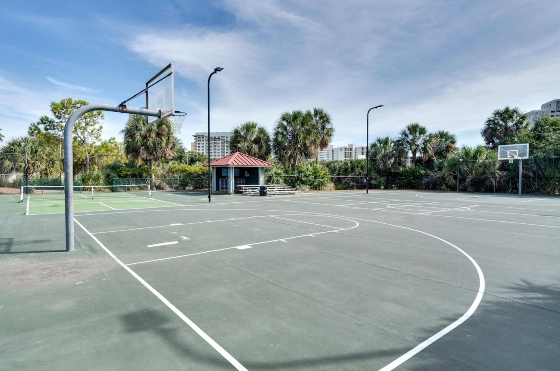 The outdoor basketball and tennis corurts at Osprey Pointe in Miramar Beach, Florida
