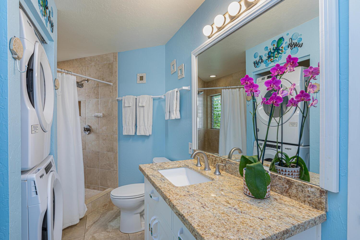 Ensuite bathroom equipped with washer and dryer
