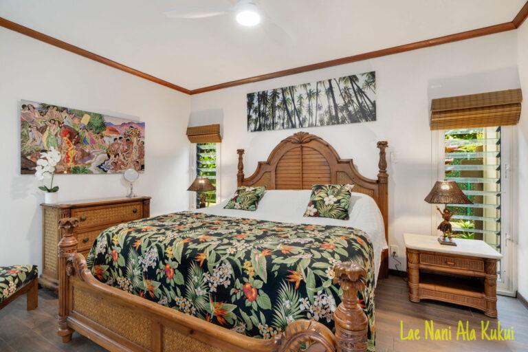 The bedroom is furnished with Hawaiian decor