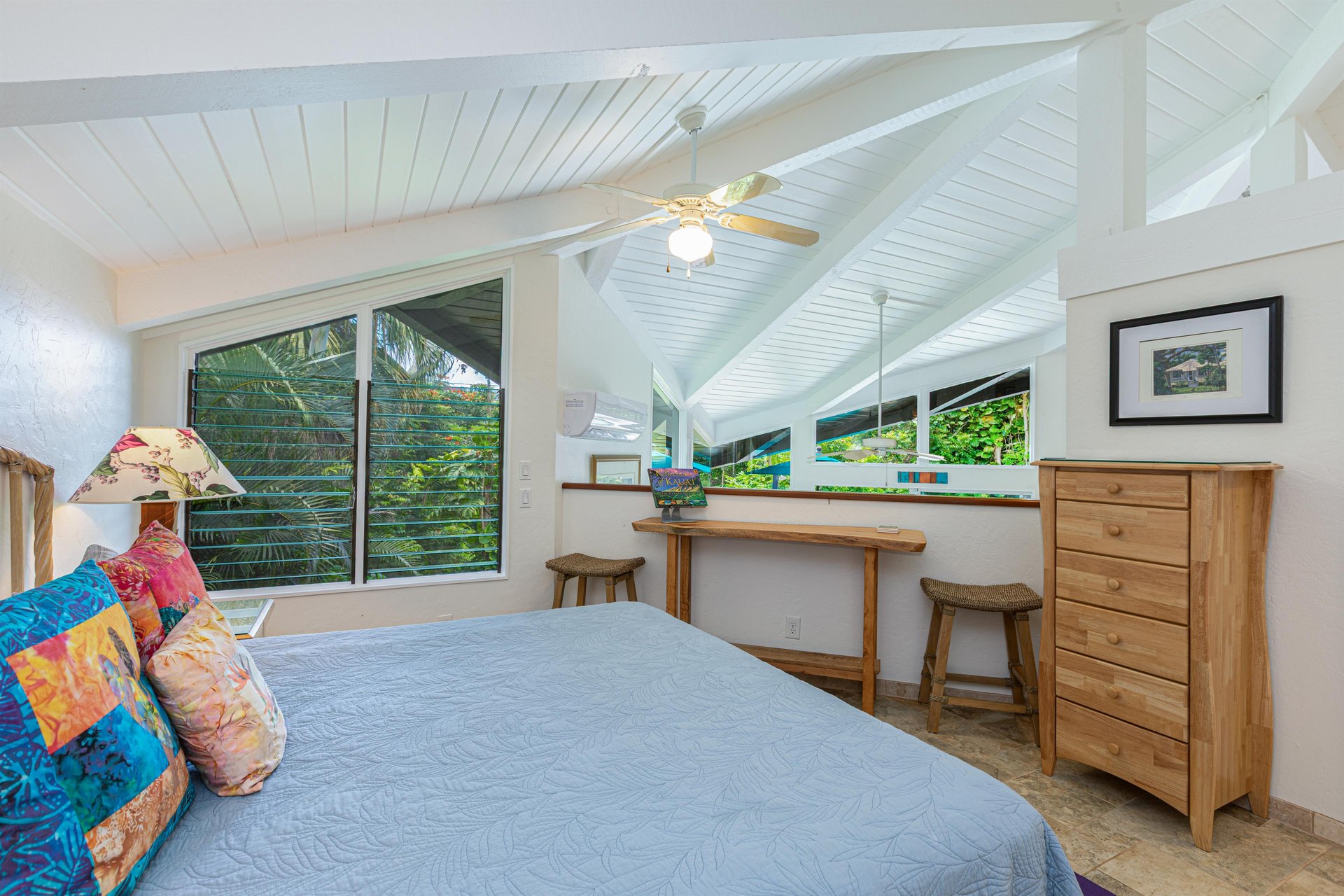 Loftstyle master bedroom has partialheight walls