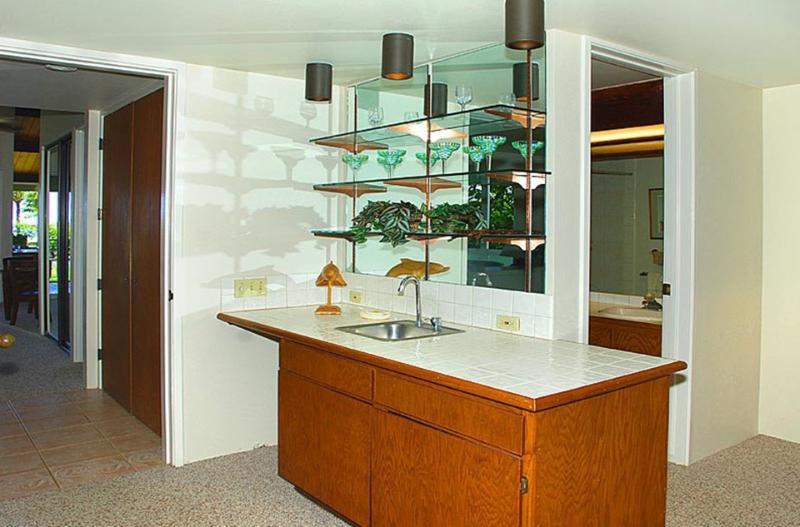The master suite includes a bar