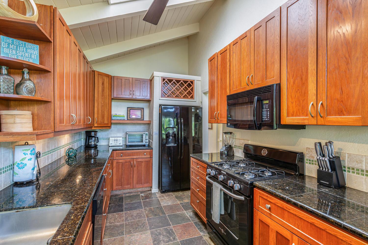 Kitchen is fully equipped with pots, pans  utensils