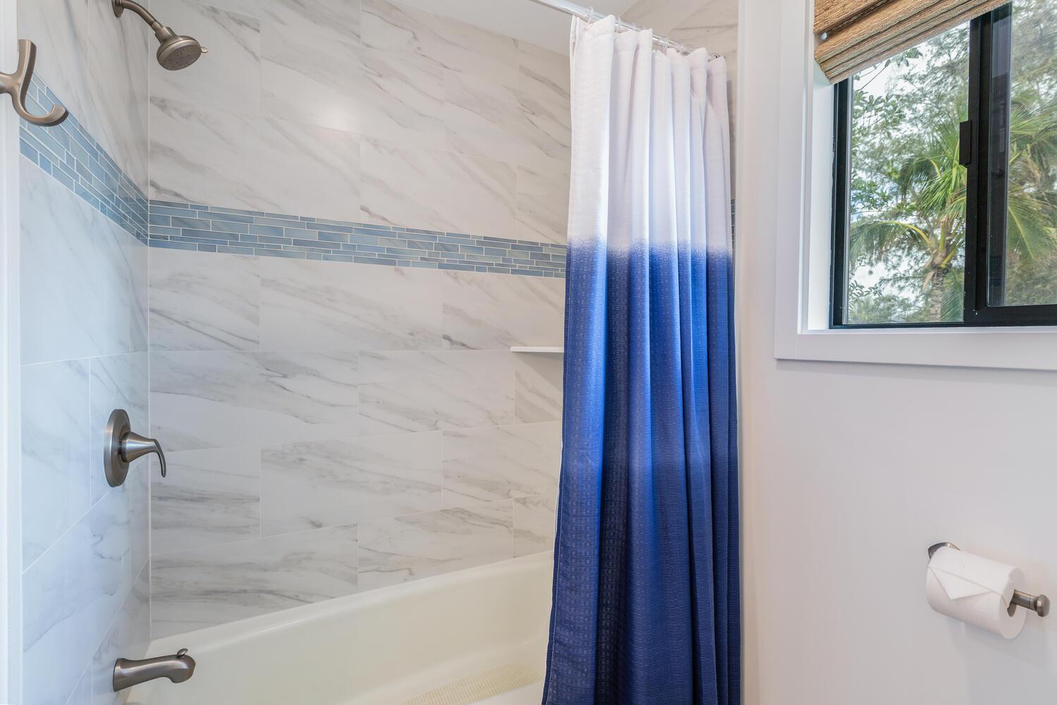 Bathroom 2 is equipped with a bath tubshower combo
