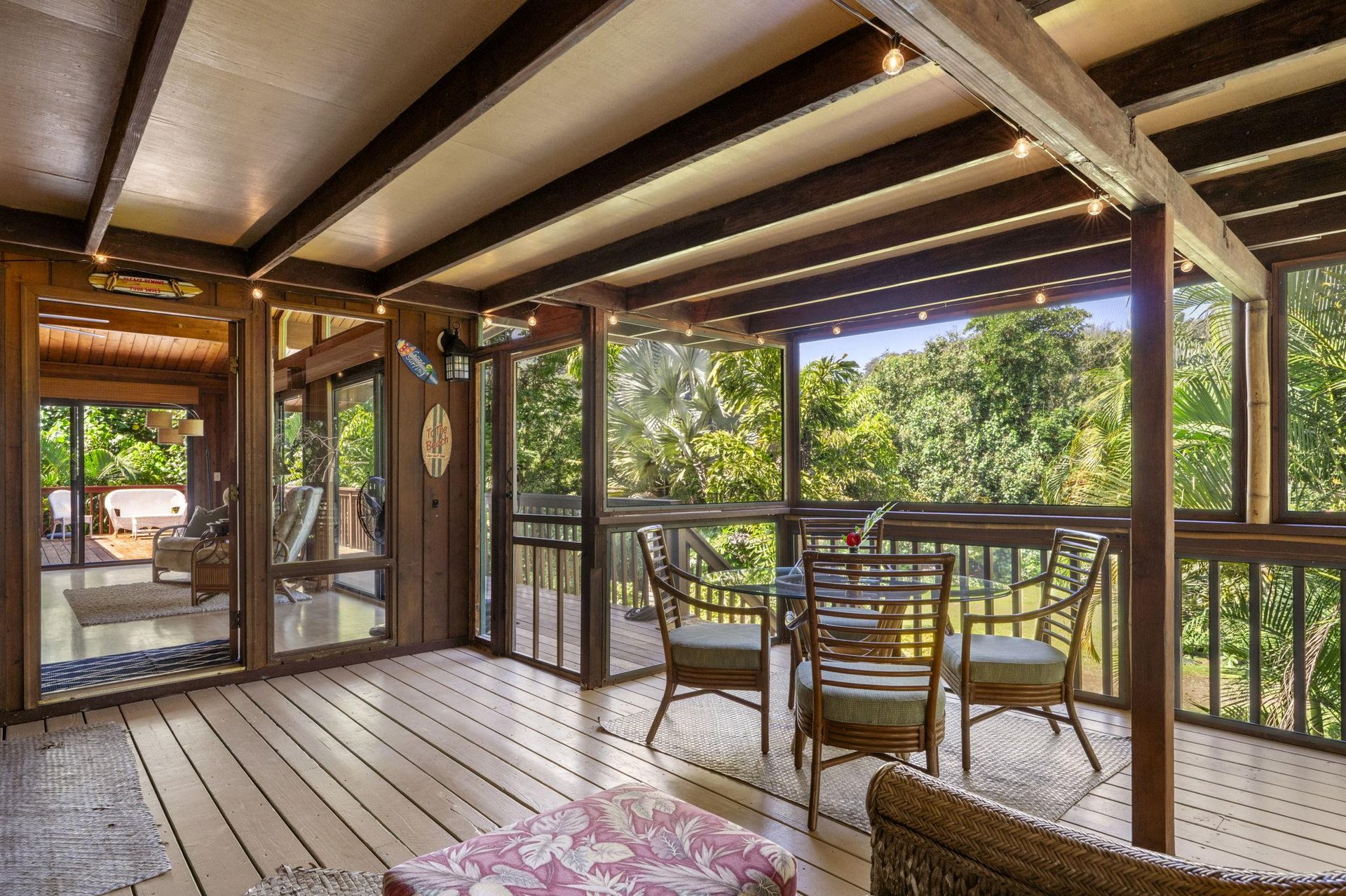 Screened lanai offers panoramic views of greenery