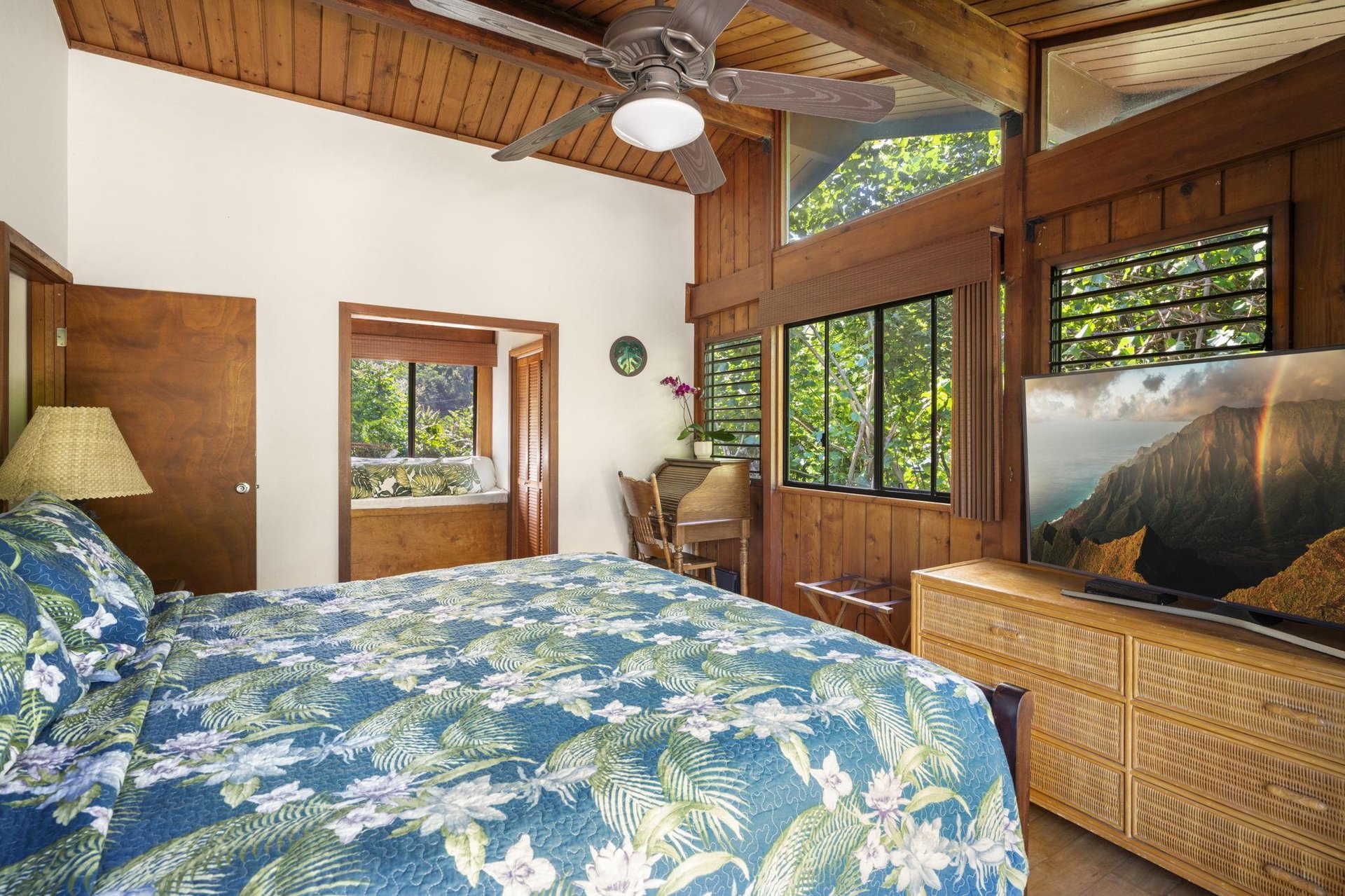 Master bedroom ceiling fan and windows offers breeze