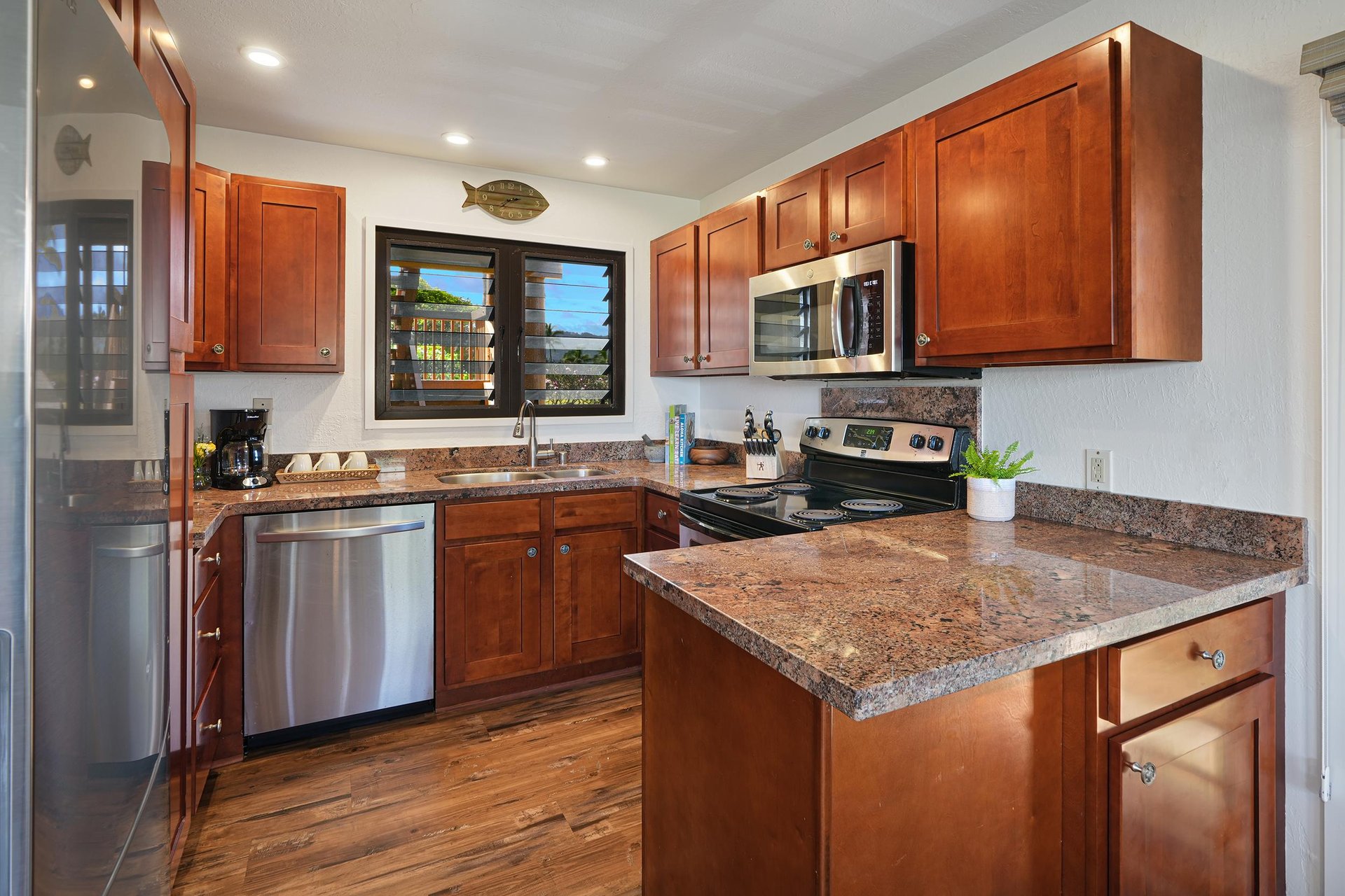 Kitchen is fully equipped with stainless steel appliances