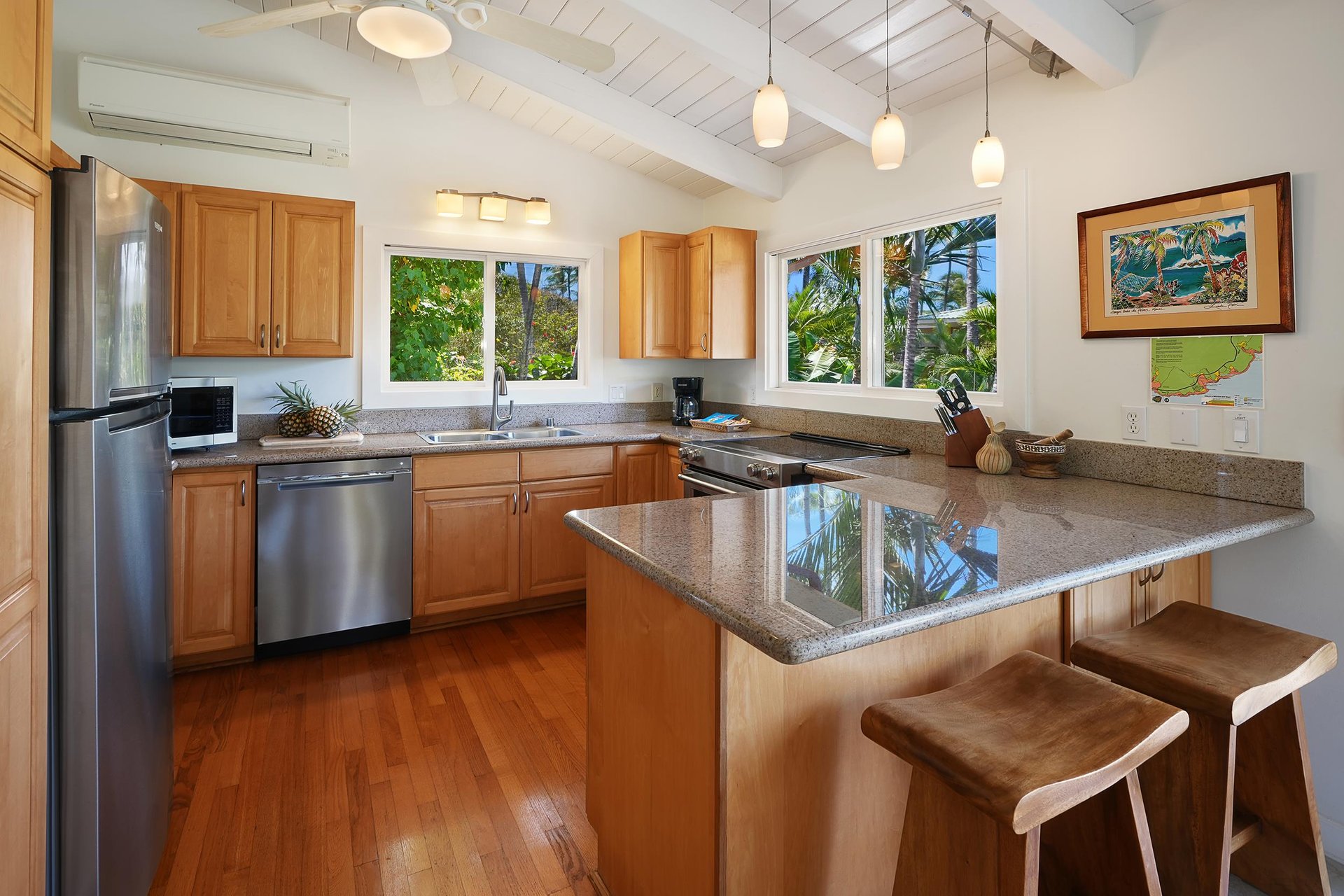 Kitchen is equipped with pots, pans, utensils and appliances