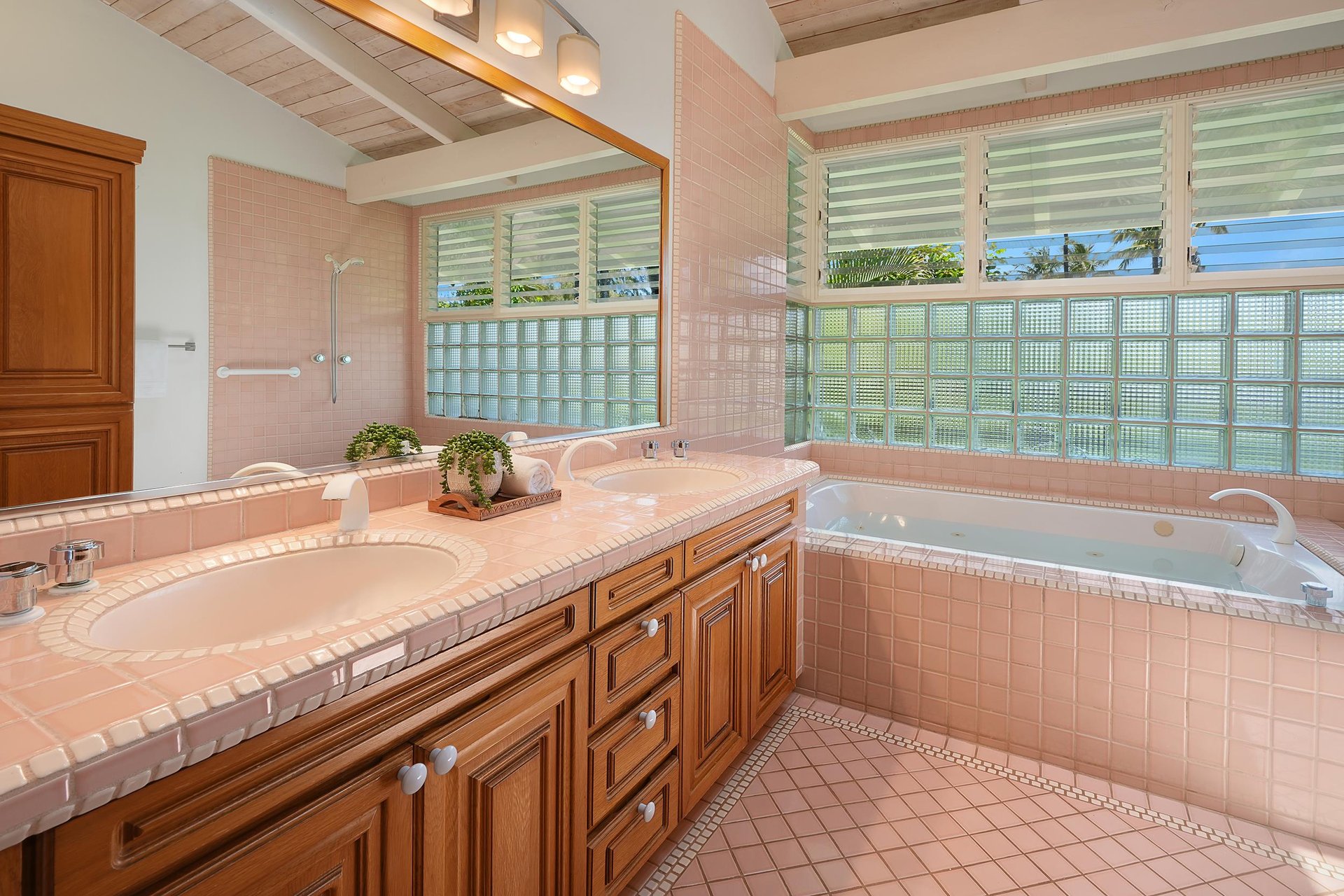 Primary ensuite bathroom with shower and jetted tub