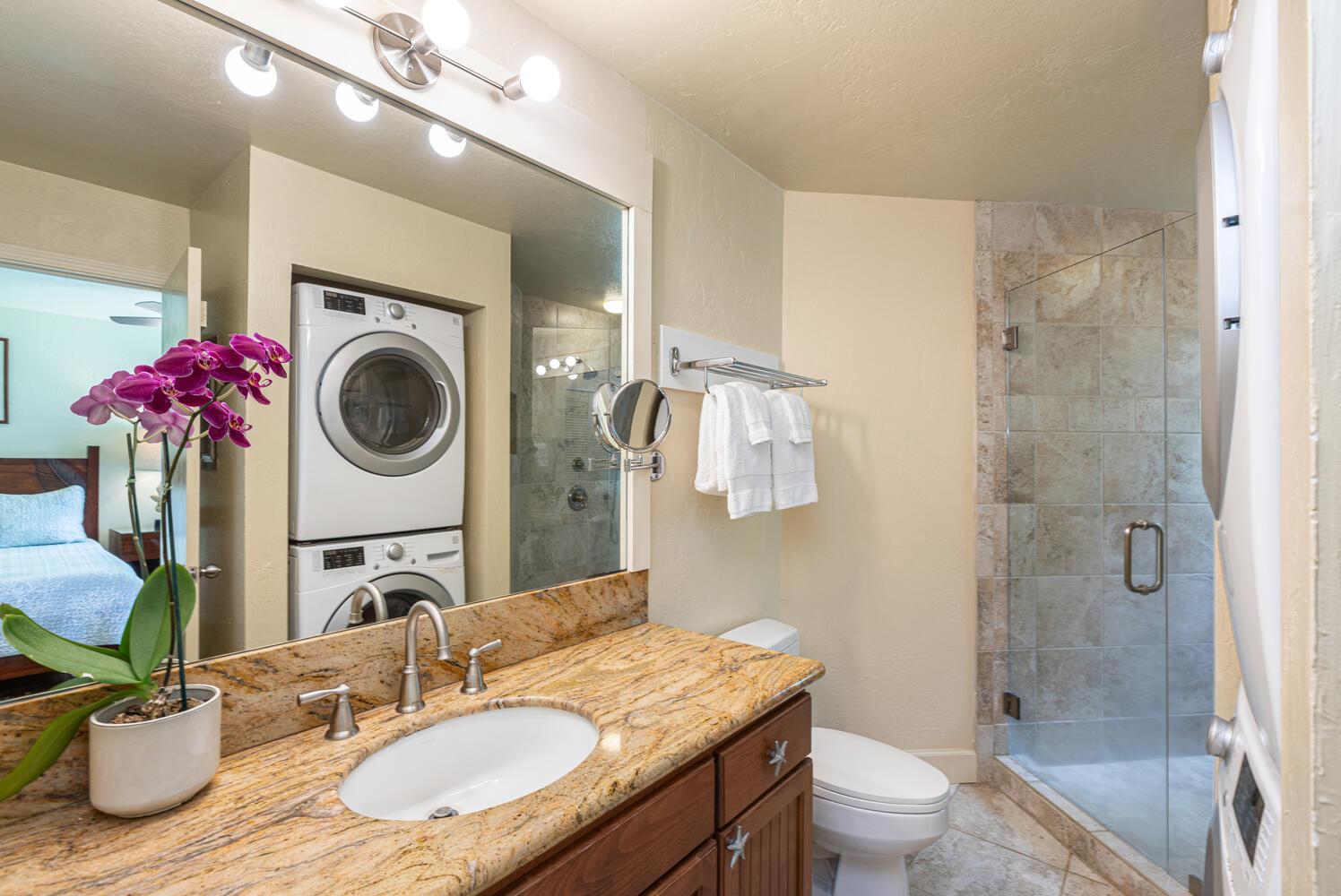 Second master bath has washer and dryer