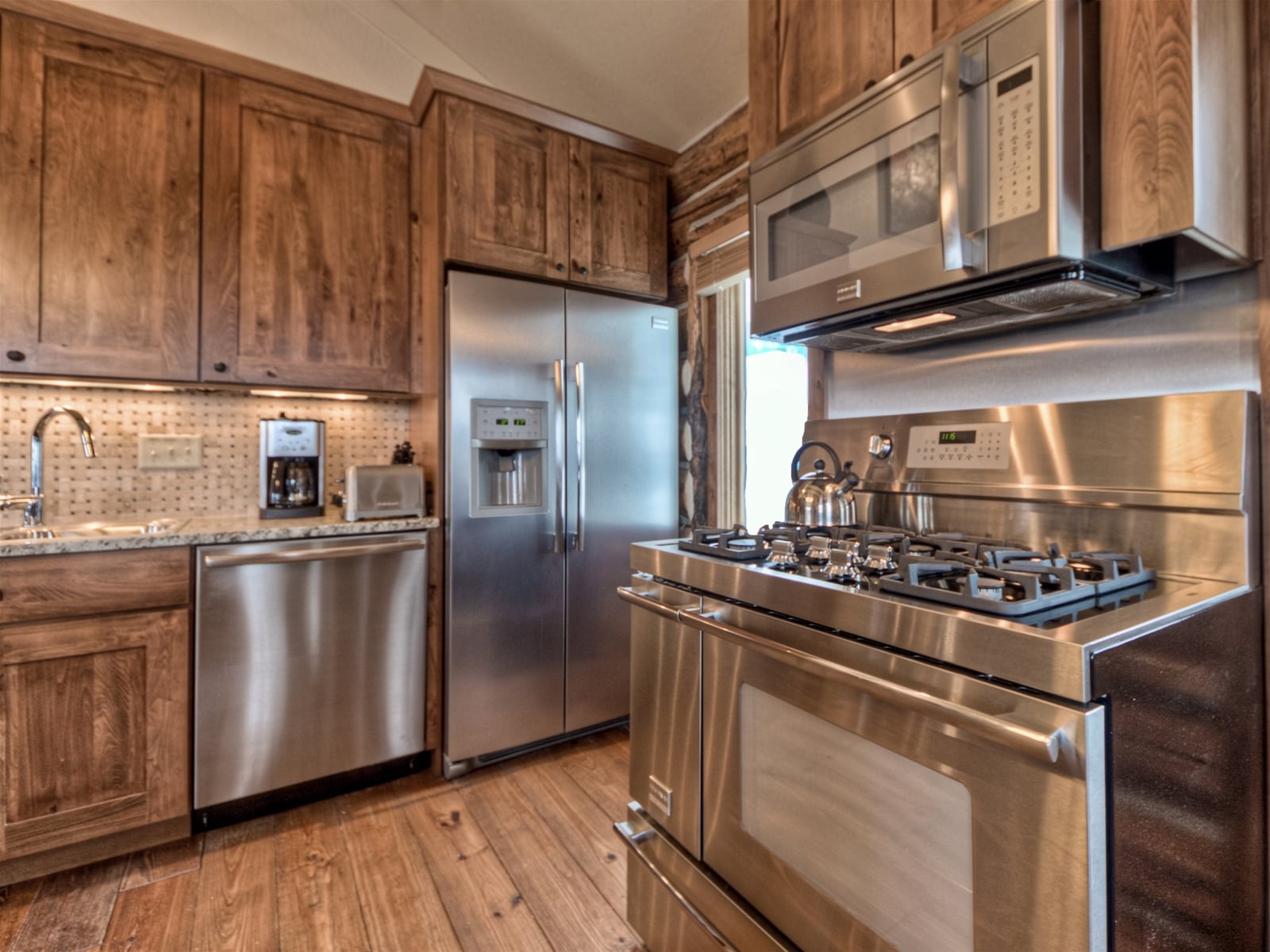 a kitchen with stainless steel appliances
