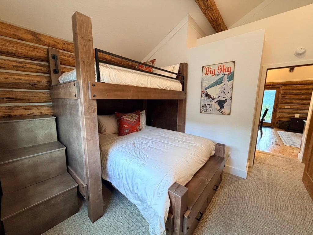 a couple of beds in a room