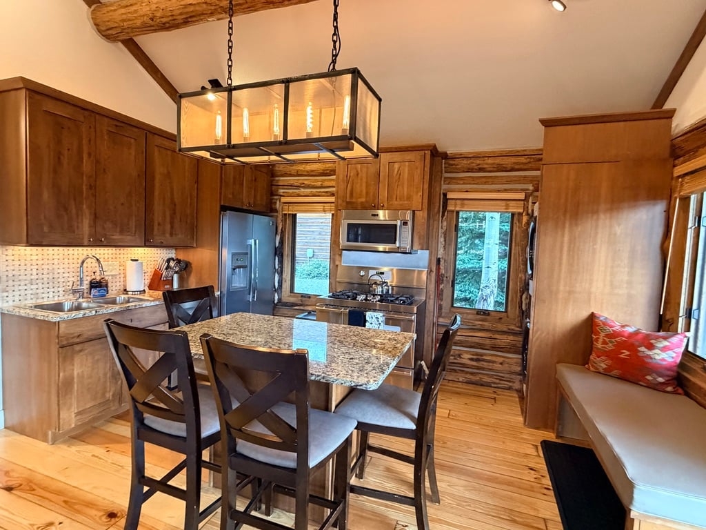 a kitchen with a dining table
