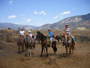a group of people riding horses