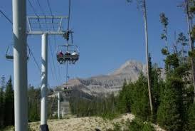 a ski lift going up a hill