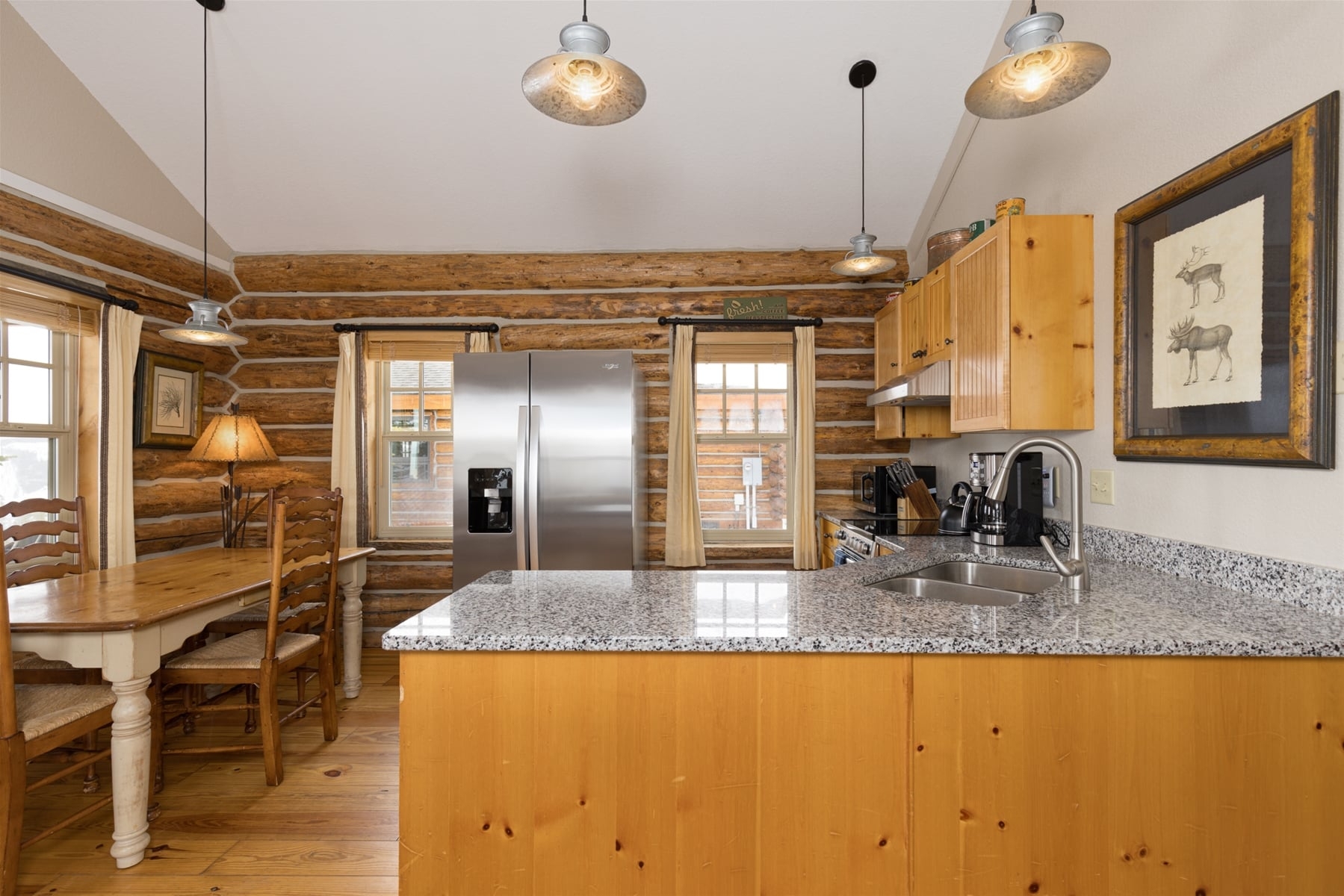 a kitchen with a marble island
