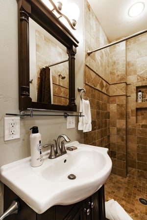 Ensuite 34 guest bathroom with tiled shower