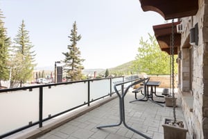 Private ski rack on patio with picnic table in the background