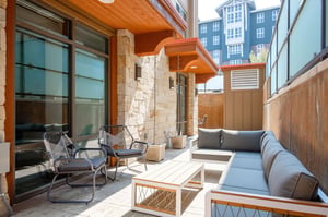 Private outdoor patio with outdoor sectional, crosshatch lounge chairs