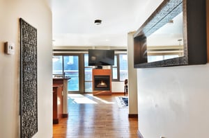 Entryway corridor looking toward the fireplace and flat screen TV
