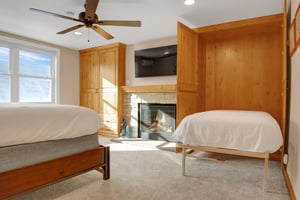 Twin murphy bed conveniently tucks away into the wooden closet in the bedroom
