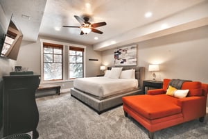 Main bedroom suite, king bed and red accent day bed,