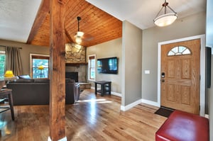 Canyon Crossing 23 entrance, impressive wooden support beam, hardwood floors and wooden accents