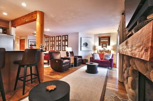 Living room includes leather recliners and a red fabric sofa and love seat