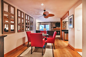 Dining area features a round table with seating for 4