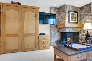 Living room features a large flatscreen TV