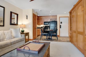 Living room looks into the kitchen and dining area