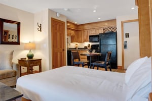 Queen murphy bed looking into the kitchen