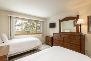 Guest bedroom with wallmounted TV