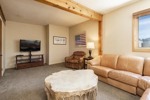 Loft area features comfortable seating and a wallmounted flat screen