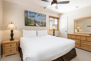 Loft bedroom features a kingsized bed