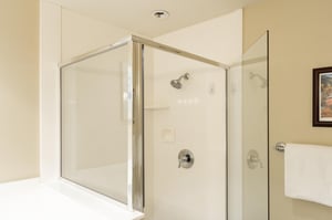 Glass enclosed shower in bathroom