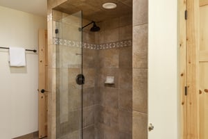 Beautiful walkin tiled shower in the main bedroom