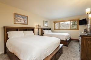 Guest bedroom features two queensized beds