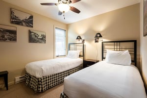 Two twinsized beds in the second bedroom