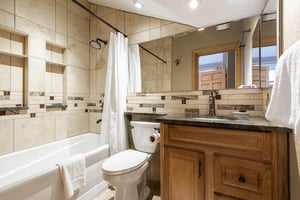 Third bathroom with showertub combo